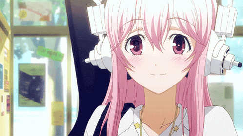 a girl with pink hair is wearing headphones and looking at the camera