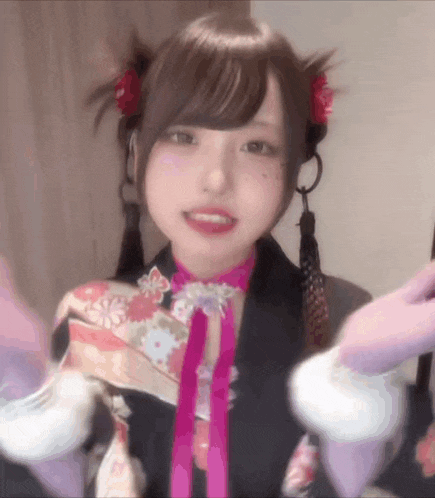 a girl in a kimono is holding a purple ice cream cone