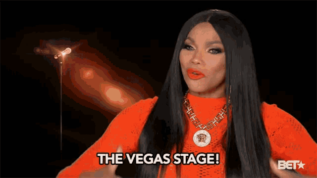 a woman says the vegas stage while pointing her fingers
