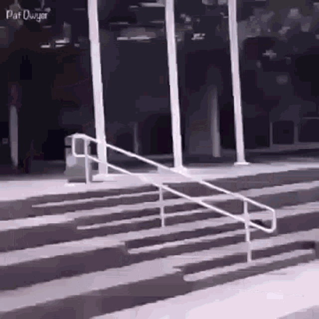 a skateboarder is doing a trick on a set of stairs