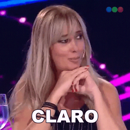 a woman with blonde hair is making a funny face and the word claro is above her head