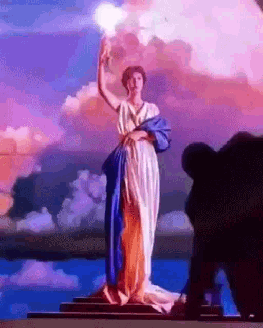 Columbia Torch Lady GIF - Columbia Torch Lady Hit Him With A Torch GIFs