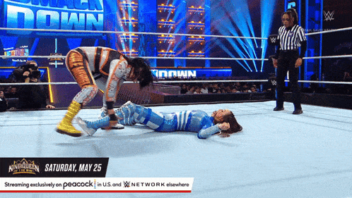 two women are wrestling in a wrestling ring with the date of saturday may 25