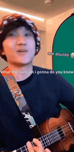 a person playing a guitar with the words " what the fuck am i gonna do you know " on the bottom