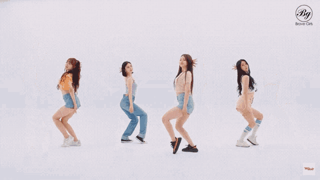 a group of girls are dancing in front of a white background with a bg logo