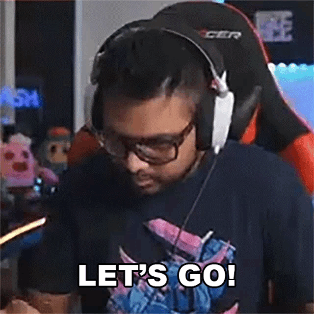 a man wearing headphones and glasses is saying let 's go !