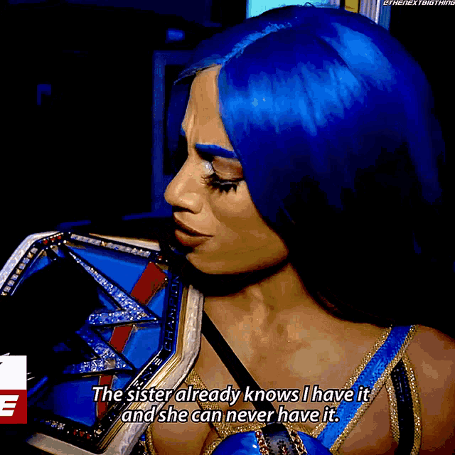 a female wrestler with blue hair says the sister already knows i have it and she can never have it ..