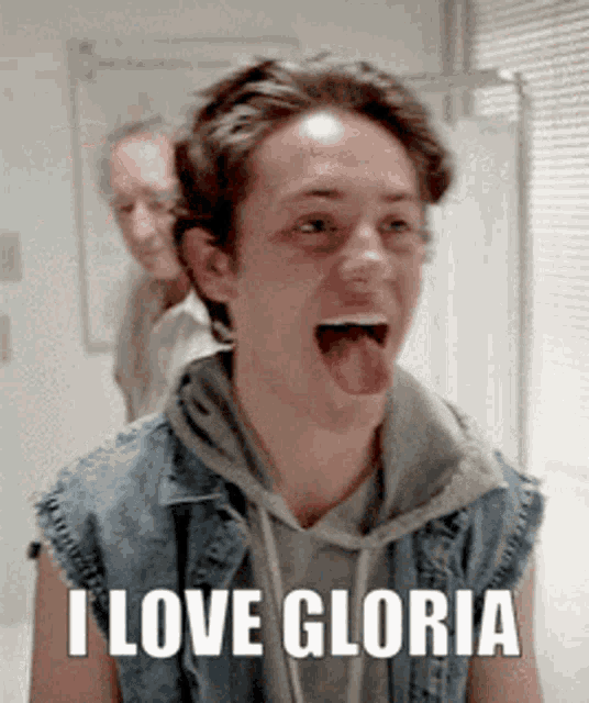 a young man with his tongue hanging out and the words i love gloria on the bottom
