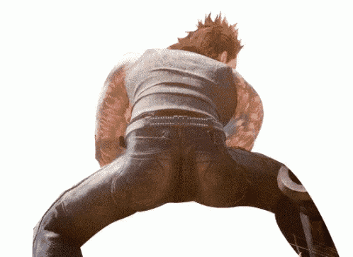a man with tattoos on his arms and legs is doing a butt flip .