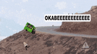 a green truck is going down a hill and says okabeeeeeeeeee