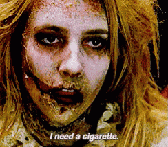 a woman with a cigarette in her mouth says i need a cigarette ..
