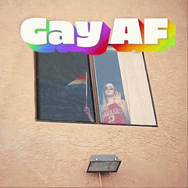 a poster for gay af shows a woman in a savage jersey looking out of a window