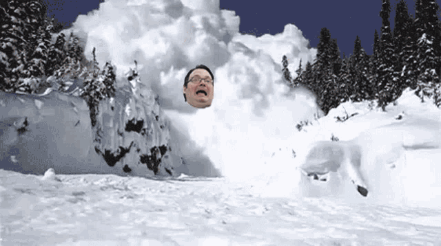 a man with glasses is covered in snow