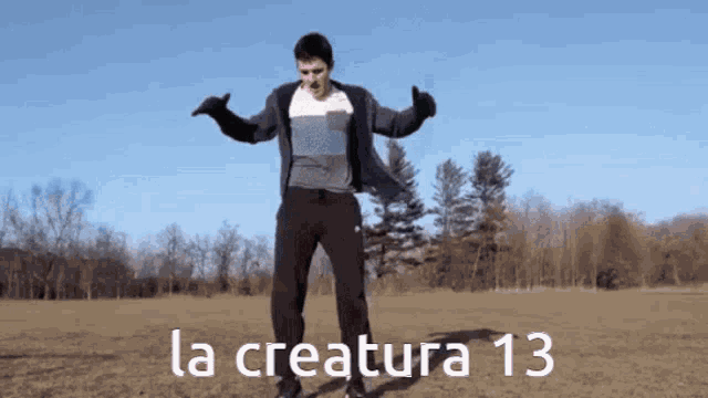 a man is dancing in a field with the words la creatura 13 written on the bottom