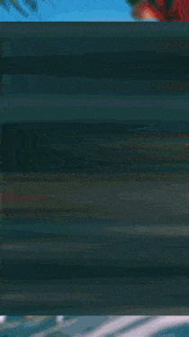 a blurry image of a person 's face with a blue background