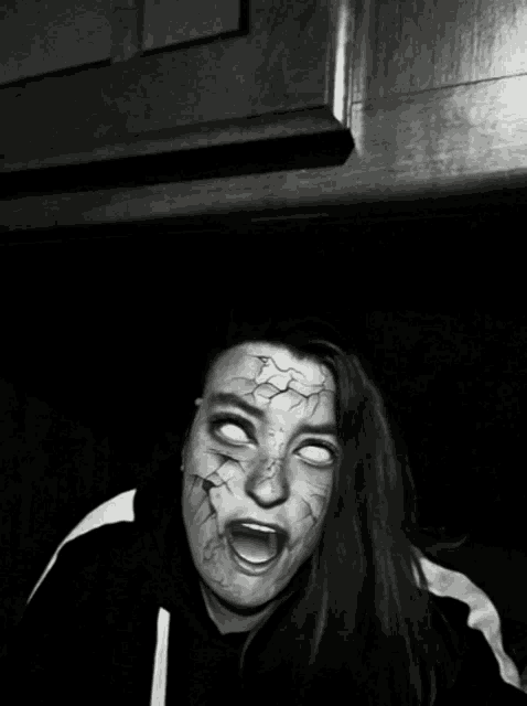 a woman with a scary face has white eyes