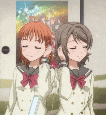 two anime girls are listening to music together
