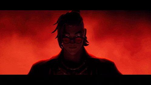 a group of people are standing in a dark room with red lights