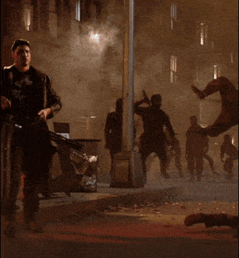 a man in a punisher costume holding a gun