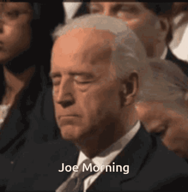 a man in a suit and tie with his eyes closed and the words joe morning above him