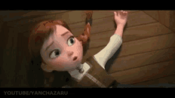 a little girl from the movie frozen is laying on the floor and looking up .