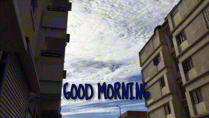 a good morning message is displayed between two buildings