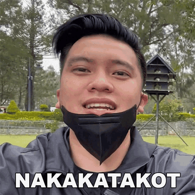 a man wearing a mask says nakakatakot on the bottom