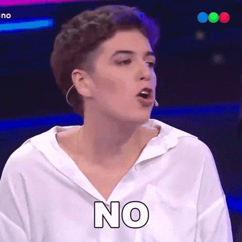 a woman wearing a white shirt says no