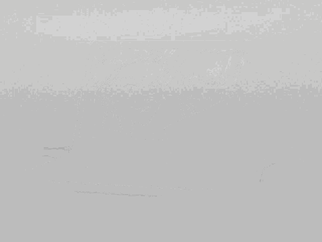 a laptop with a black and white drawing of two anime characters on the screen