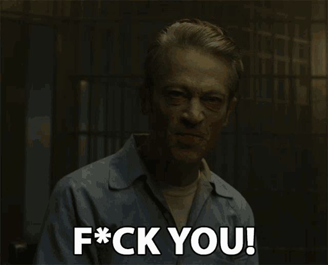 a man in a blue shirt says f*ck you
