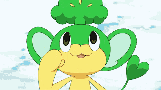 a green and yellow cartoon monkey with a green head