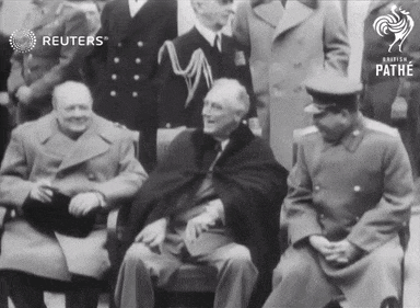 a group of men are sitting in front of a sign that says reuters on it