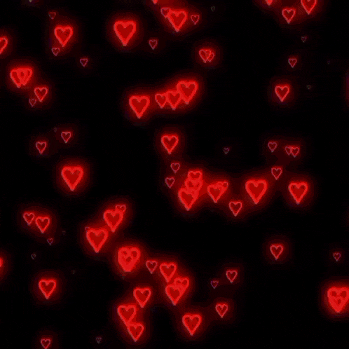 a girl in a green jacket stands in front of a black background with hearts and the words kim chaewon and min gigi on it