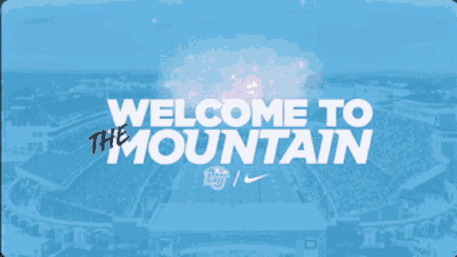 a blue sign that says welcome to the mountain on it