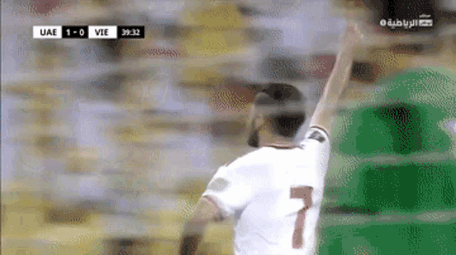 a soccer player wearing a white jersey with the number 7