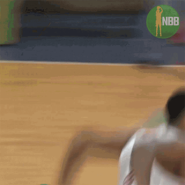 a blurry picture of a basketball player with a nbb logo in the corner