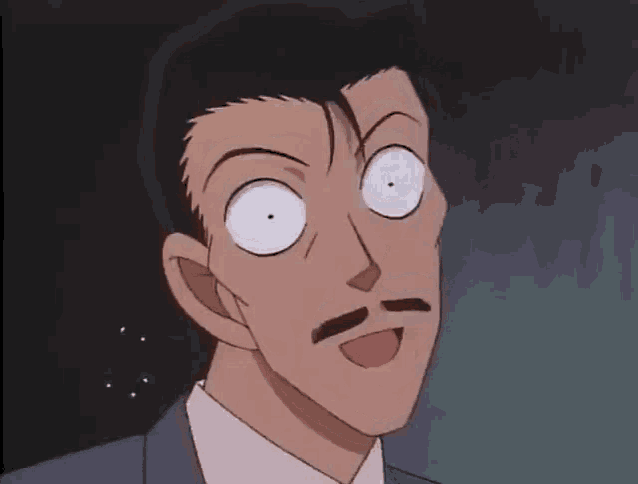 a man with a mustache is making a funny face with his eyes wide open .