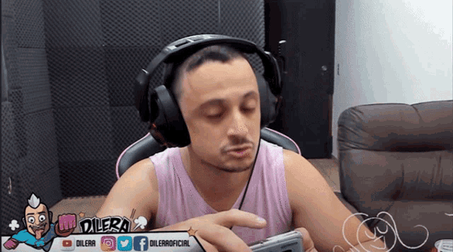 a man wearing headphones and a banner that says dilera on it