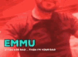 a man in a red shirt and tie with the name emmu on it