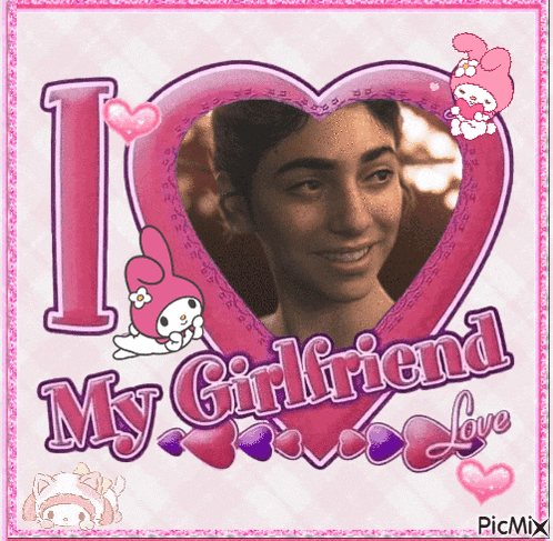a picture of a woman in a heart shaped frame that says " i love my girlfriend "