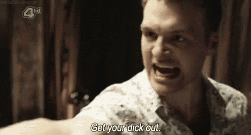 a man is screaming and saying `` get your dick out '' while holding his fist up in the air .