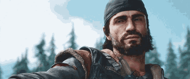 a man with a beard wearing a hat that says ' axton ' on it