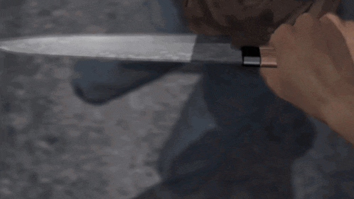 a man in a brown shirt is holding a large knife in his hand