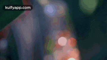 a blurry picture of a man 's face with the words kulfyapp.com at the bottom .