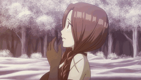 a girl with braided hair is standing in a forest