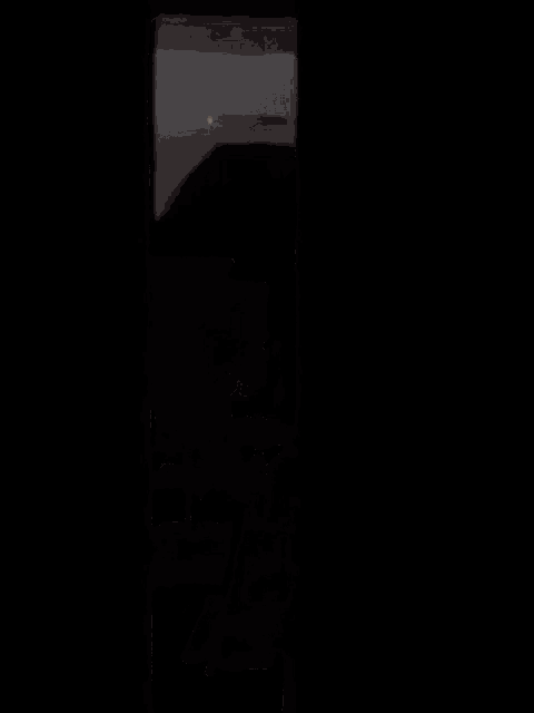 a young man in a hooded jacket is peeking through a doorway