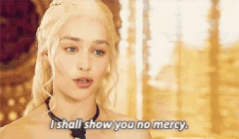 a woman says i shall show you no mercy while wearing a necklace