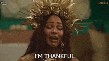 a woman wearing a crown of gold flowers is crying and the words from the bottom of my heart are next to her