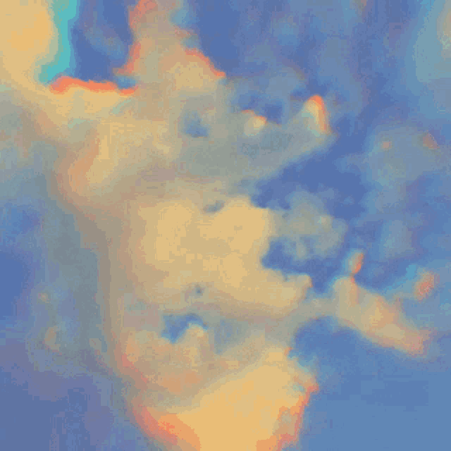 colorful clouds in a blue sky with a rainbow in the middle