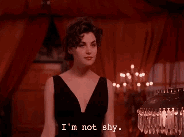 a woman in a black dress says i 'm not shy